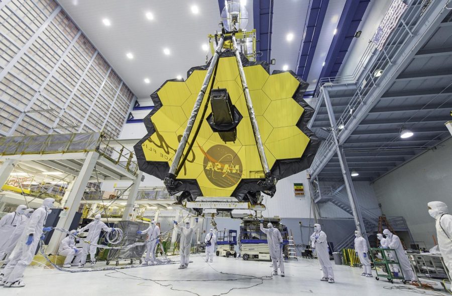 The James Webb Telescope testing its unfolding sequence. (Courtesy of NASA).