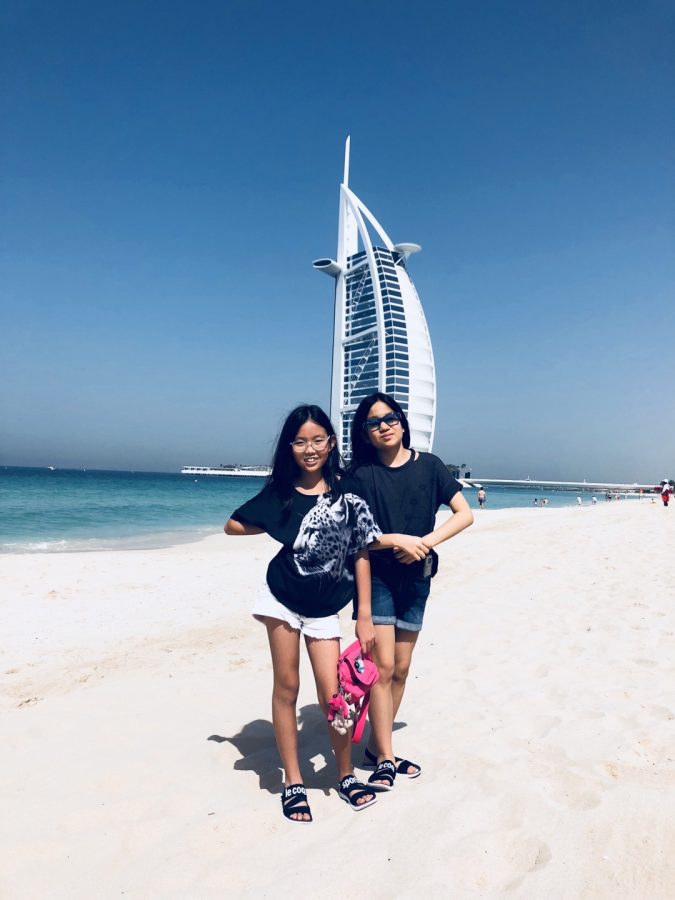 Leanne and her cousin bask in the beach sun in front of the Burj Al Arab, Dubais most iconic hotel. Courtesy of Leannes family.