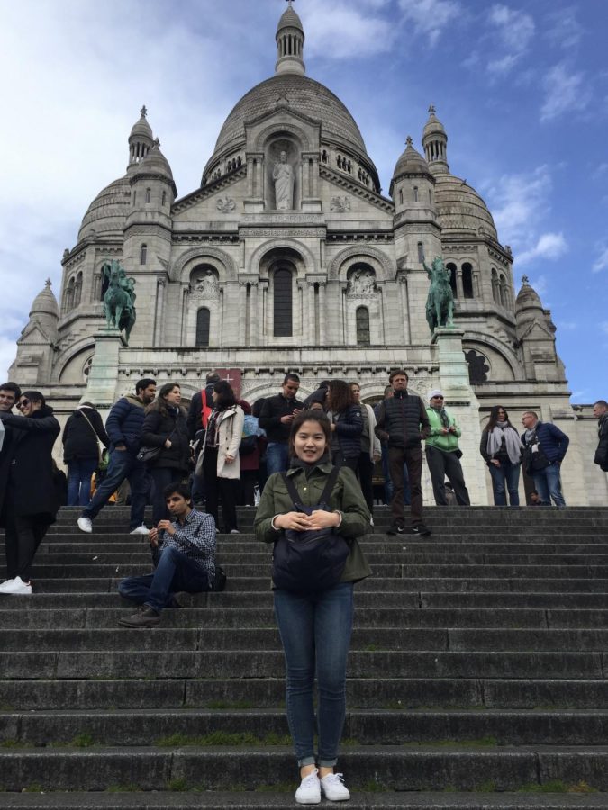 Ms. Choi beams in front of the famous Basilique du Sacré-Cœur in Paris. Courtesy of Ms. Chois family.