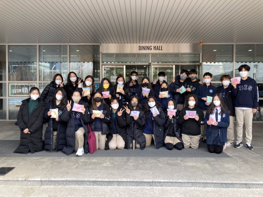 NJHS members show off their finished beanies that they all hand-sewed from special kits. They were sent off to help warm up youngsters in Vietnam. Photo courtesy NJHS.