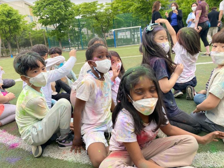 1st graders take a seat while they learned about Hindu culture at the SOAR Holi Festival. Photo courtesy of SOAR.