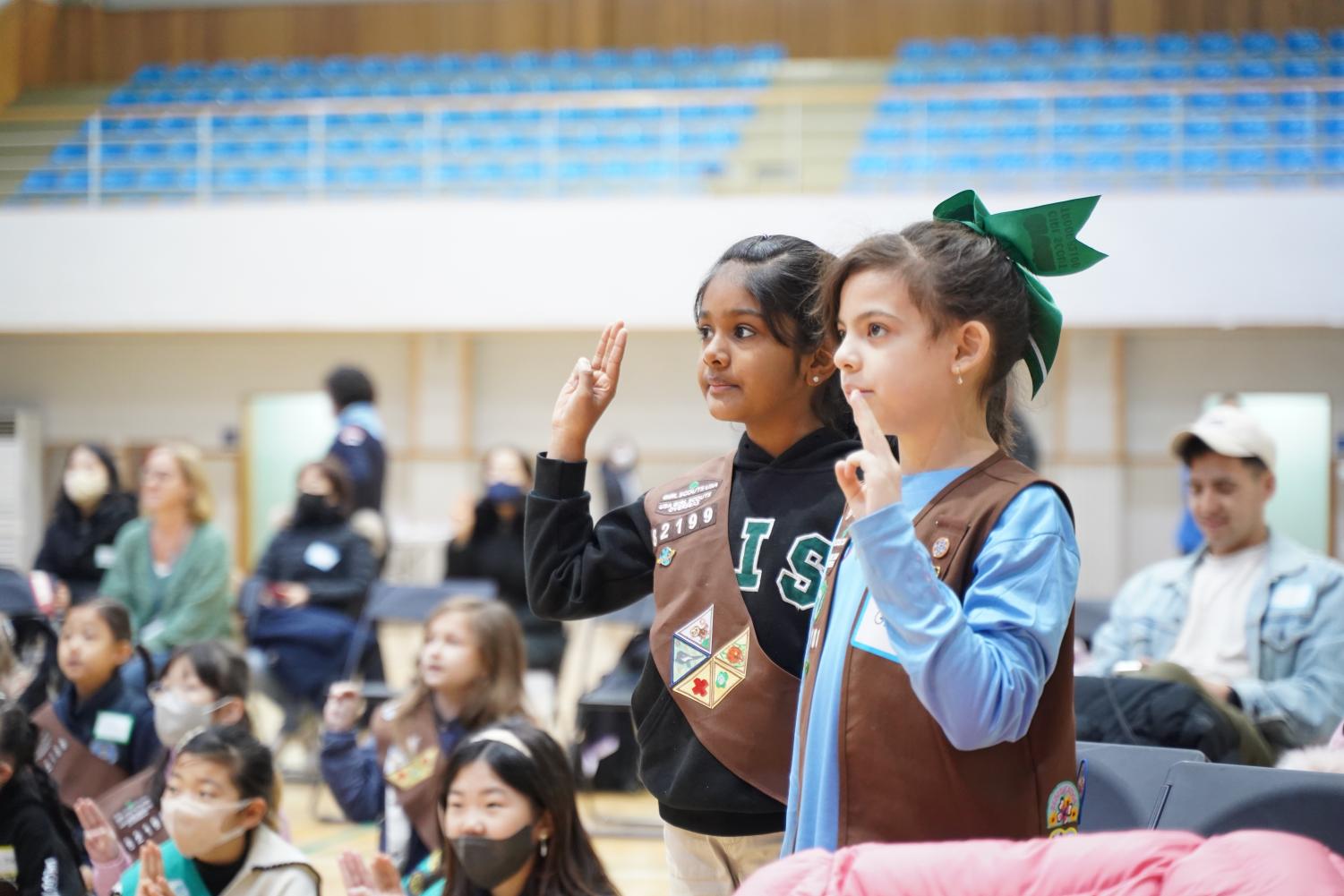 girl scouts taking oath