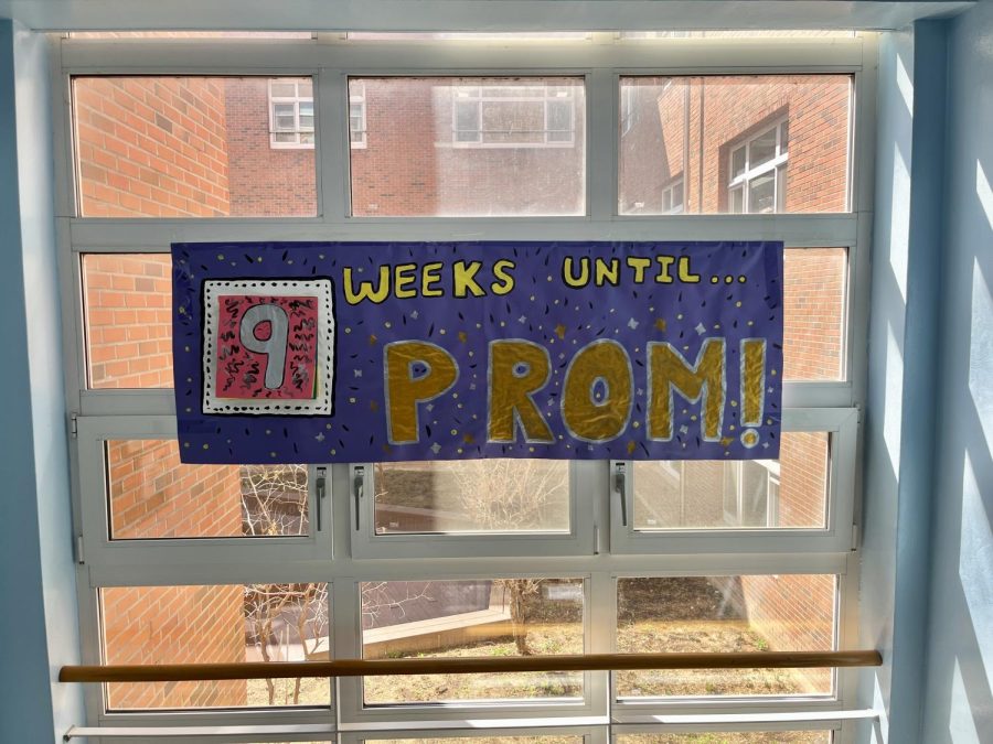 A colorful banner counts down the weeks left until prom on the second-floor stairwell. According to Prom Committee members, the purpose behind the visual banner is to create excitement and engagement for a more successful event. Photo by Raina Lee.