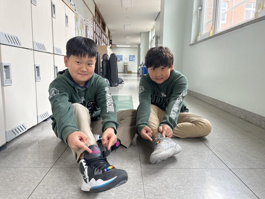 Pyo and Joseph show off their newly added rainbow shoelaces. Photo by Raina Lee.