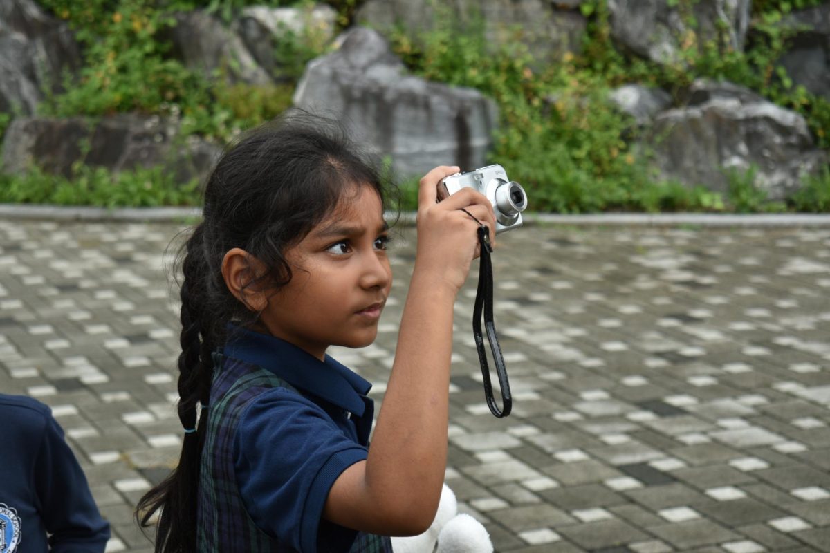 Young shutterbugs take steps to match the pros