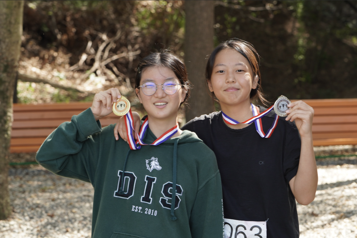 Mika in 8th grade and Yul in 7th grade win the gold and silver. Spectators cheer as the athletes stand proud. Mika and Yul look to place at the top the podium again in November. Photo by Ethan Rossmeisl.