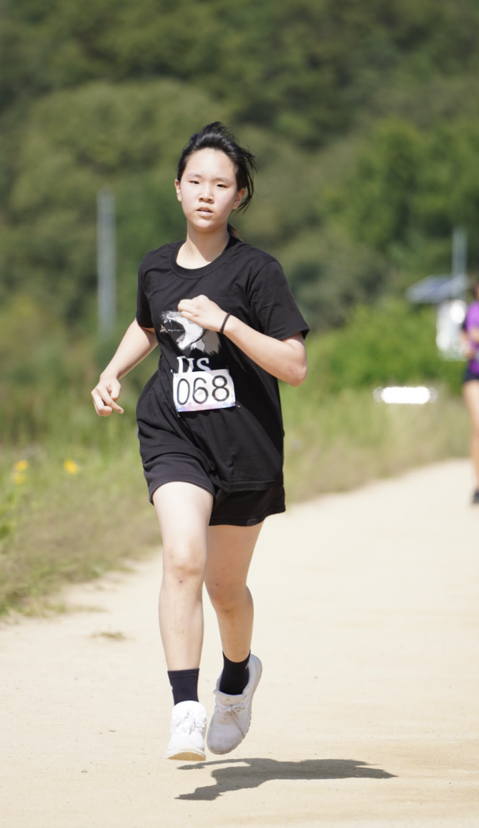 Minju Koo focuses on her last kick of the long and exhausting race. Koo joins the team as a new sixth grader.