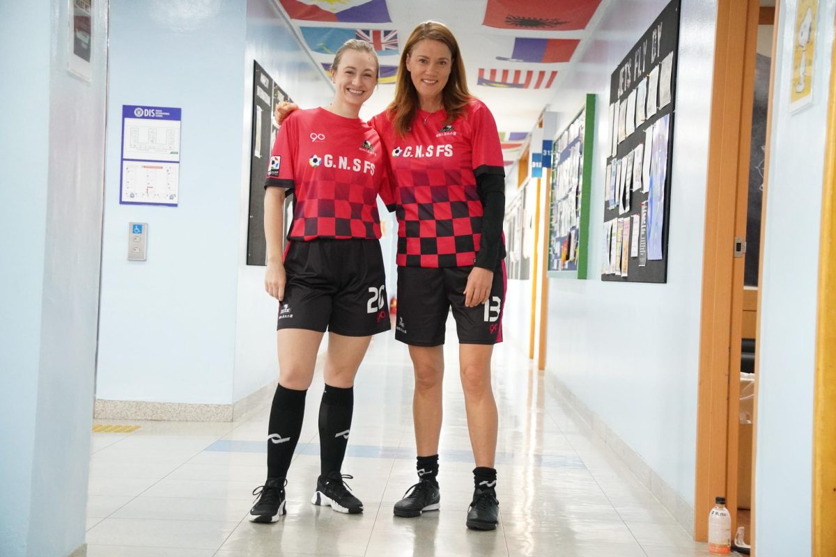 Ms.+Spaeth+and+Mrs.+Jolly+sport+their+matching+soccer+uniforms.