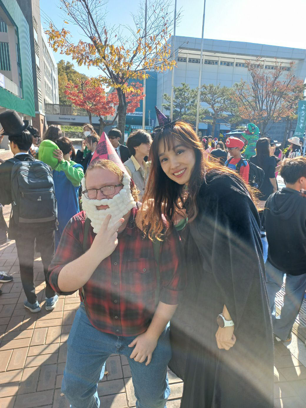 Mr. Mayo dresses up as an elf and Mrs. Kim as a witch. He shows his Halloween spirit at DIS. Photo courtesy of Mr. Mayo. 