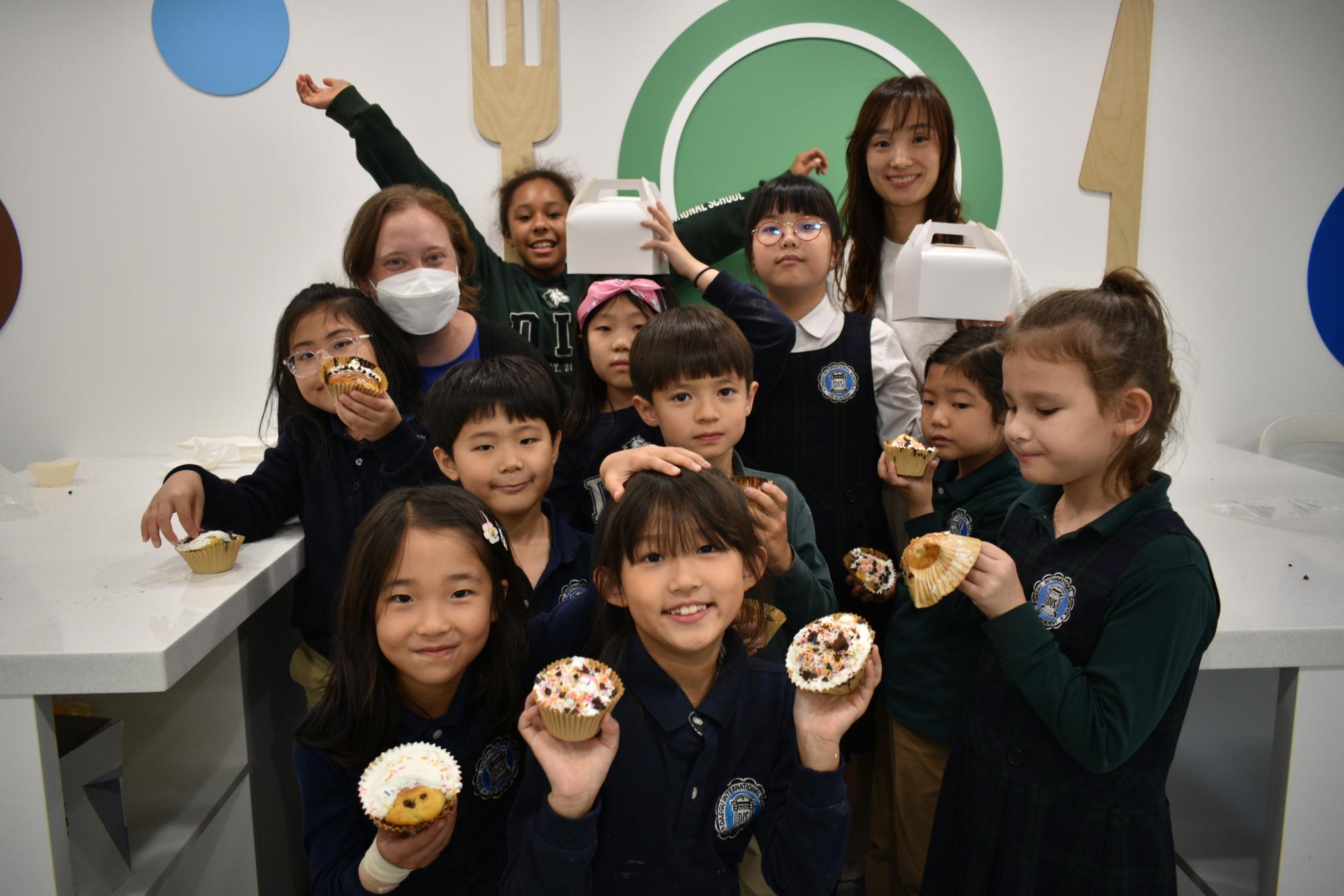 Mrs. Kim and Mrs. Morissette round up eager bakers to show off another day of successful delicacies. The young chefs fill their mouths with cupcakes and bring the leftovers home for friends and family. 
