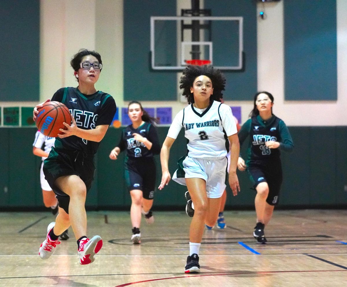 Point+guard+Minori+Kojima+outruns+the+defense+after+a+turnover.+She+hurries+toward+the+basket+for+the+layup.+Her+fast-break+leads+to+an+open+opportunity.+Photo+by+Nayoung+Kim.+