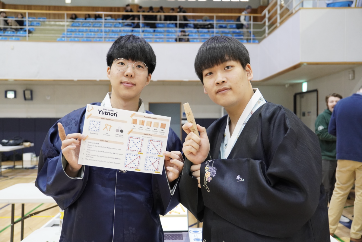 Seniors Alex Lee and David Cho wear Korean traditional clothing and surprise judges and spectators. Their attires align with their project on Yutnori, a Korean traditional board game. Photo by Sunny Oh.