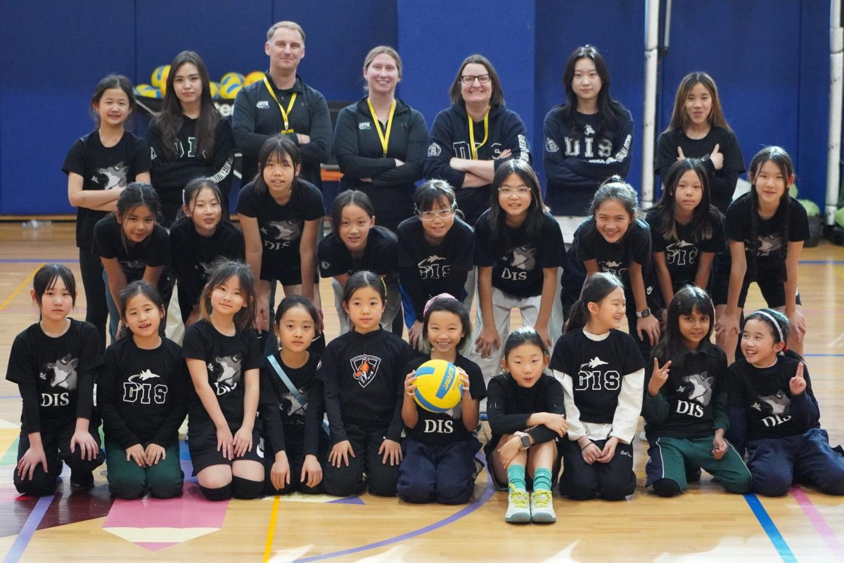 The girls and coaches are proud of their performance. The first tournament for many, the elementary squad improved leaps and bounds throughout the day. Photo by Raina Lee.