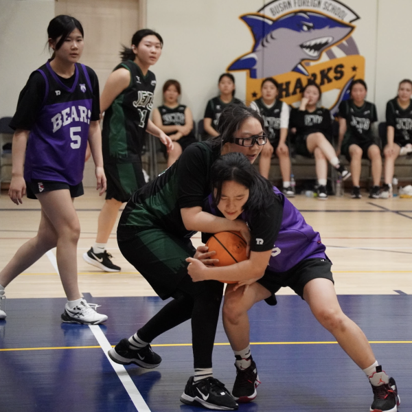 Sophomore center Amy Shim battles a BHA defender for a loose ball. Amy is down to scrap with any baller. 