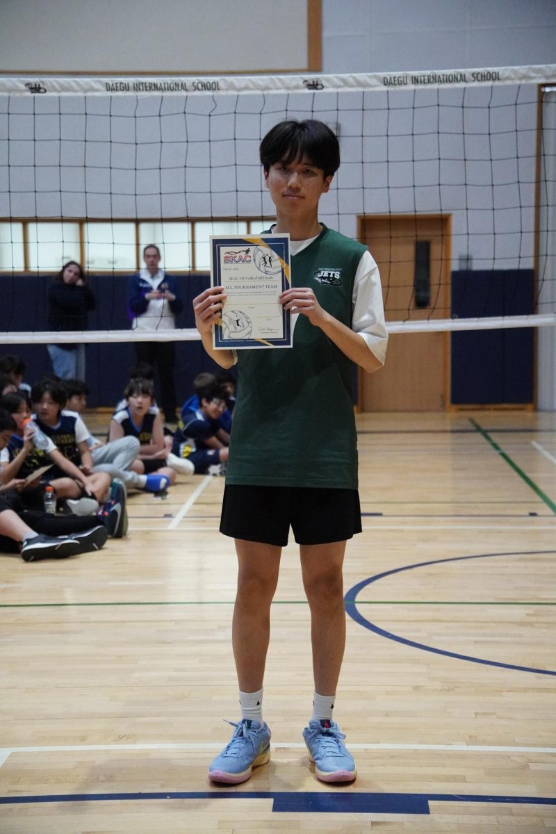 Varsity middle blocker and captain Alex Seo proudly earns the all-tournament team title alongside other elite players. His powerful spikes and serves return with a big award. 