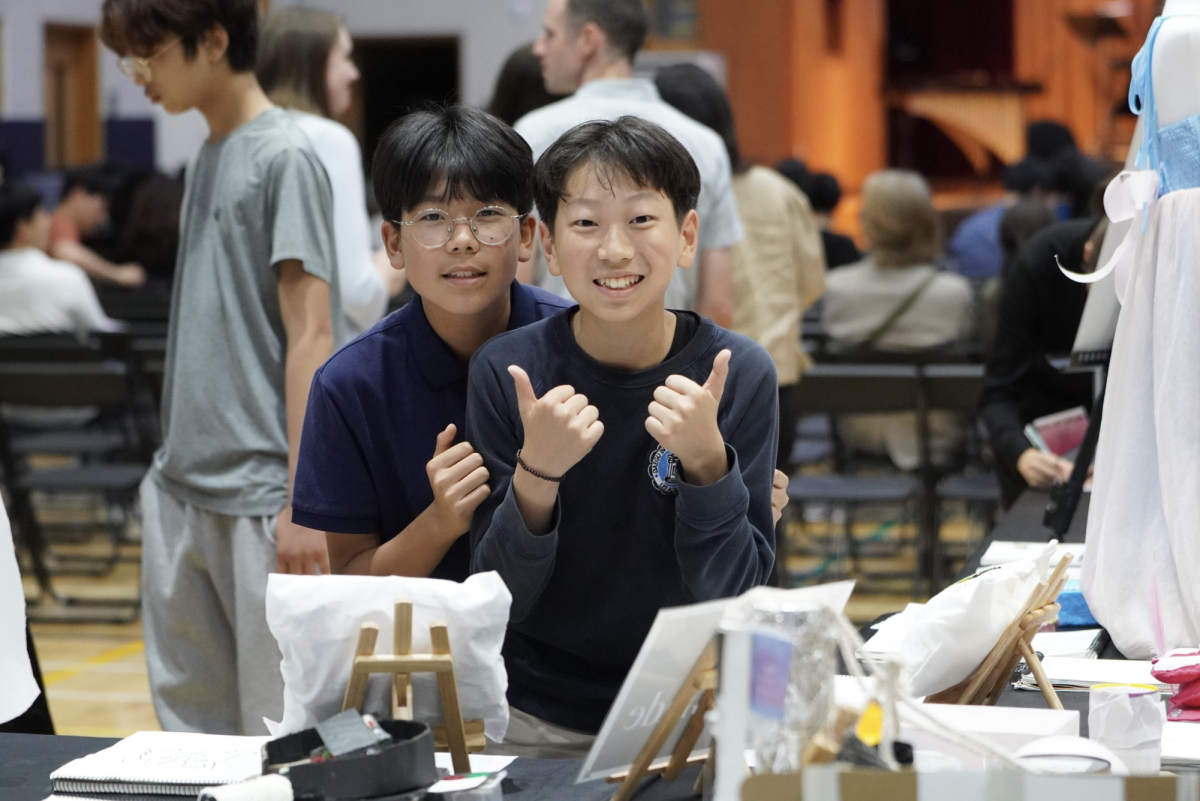 Tony Kim and Sean Kim in 6th grade mesmerize over the elementary displays put up by Mrs. Gum's class. 