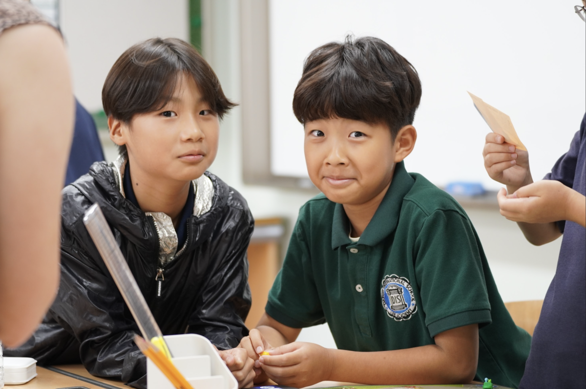 Fifth graders Kevin Jang and Gio Park suspiciously glance at the new teachers. At the top of elementary school, Jang and Park catch up on the months they spent apart. 