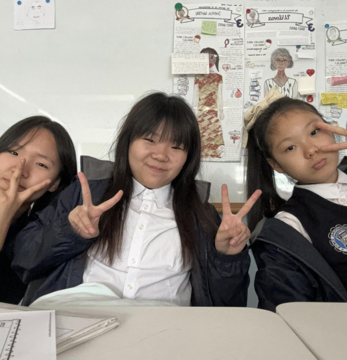 Seventh-graders Minju Koo, Olivia Park and Emily Woo become neighbors in English. They celebrate their luck with a selfie. 