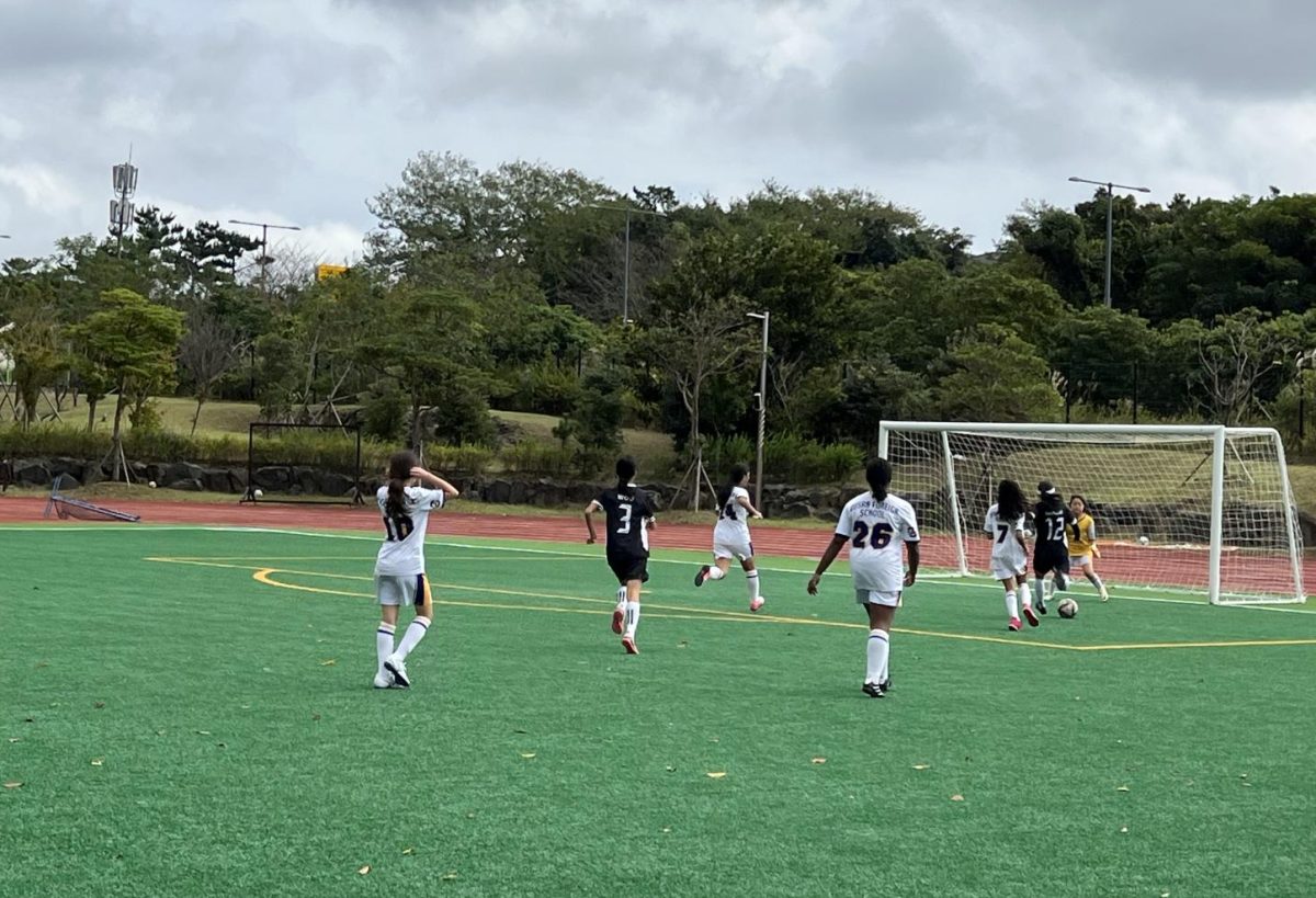 Ann Oh in 7th grade shoots the ball into the net. Her shot gives the DIS A team a 2-0 victory against BFS in the semi-finals. Photo by Annie Cho.