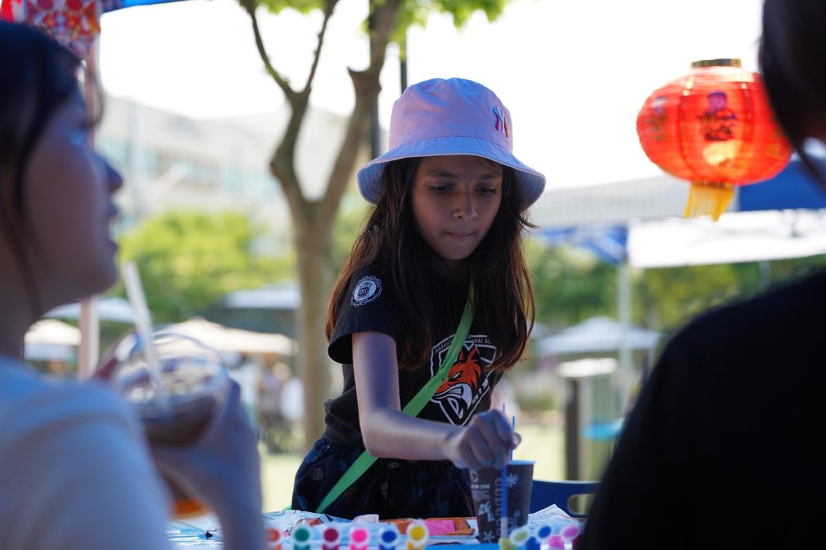 Tanushkaa Banerjee in third grade eagerly participates in the painting event hosted by the National Chinese Honor Society. This year, the group returns with a spiced-up addition of Chinese traditional calligraphy. 