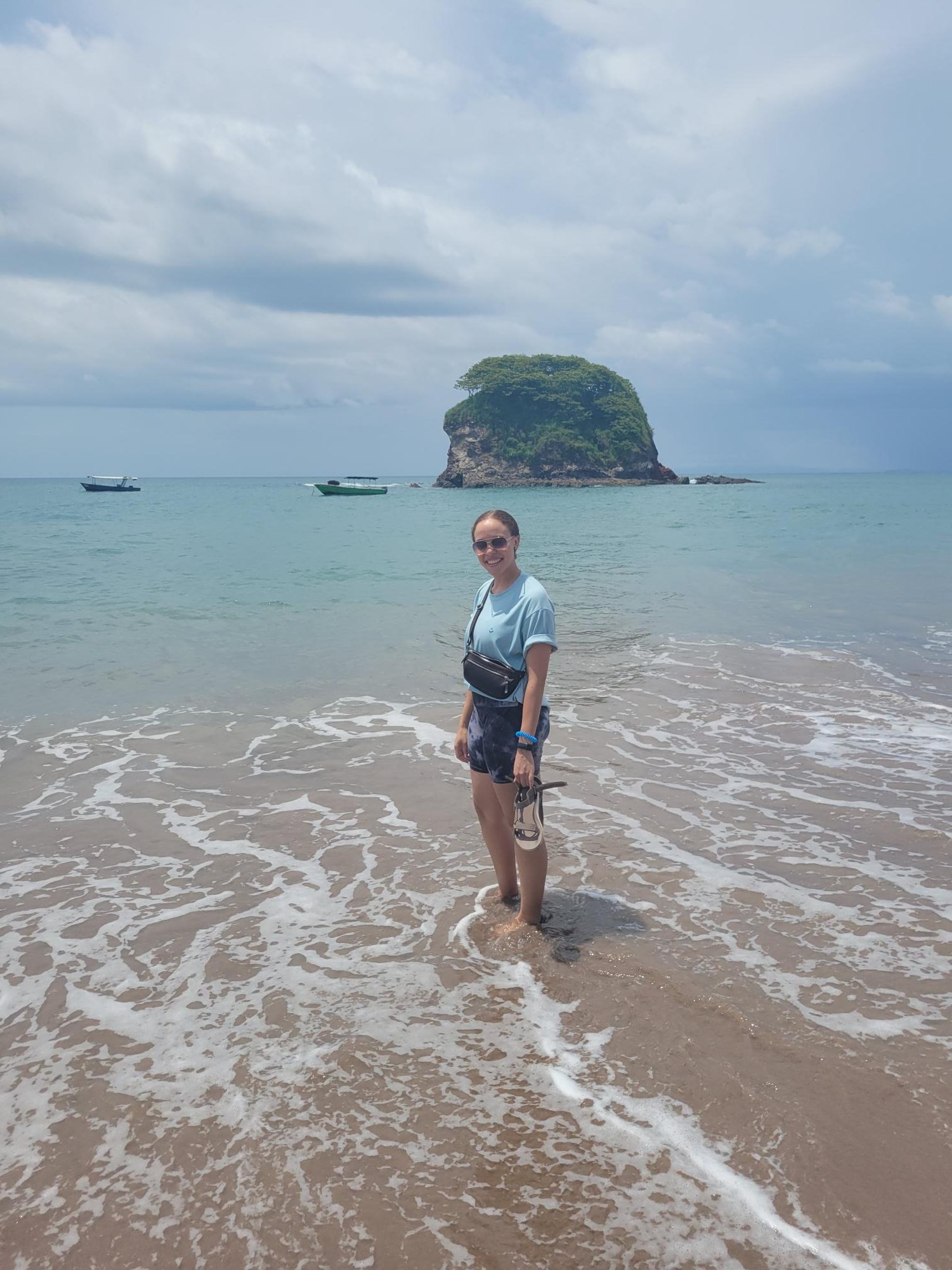 Sandals off, Ms. Dennard feels the coarse sand and the rush of sky-blue waves of Tenerife, Costa Rica. Photo courtesy of Ms. Dennard.