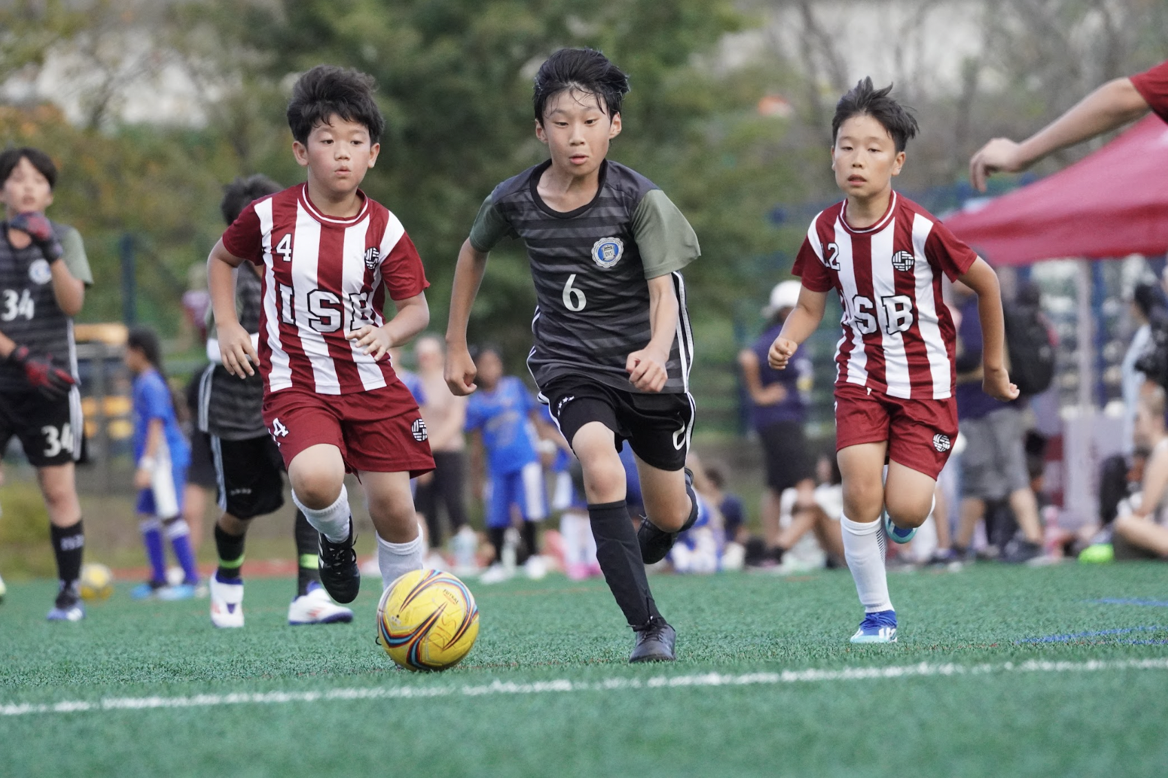 Weejee Kung in fourth grade sprints towards the goal, on a breakaway.