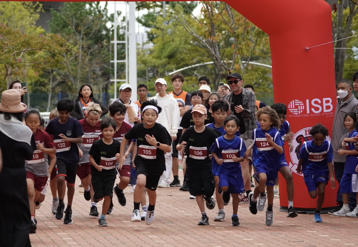 "On your mark, get set, go." The elementary boys starts off strong after the whistle. They maintain their pace and cheer each other up.