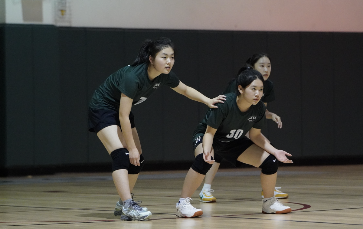  Apple Jun (7) pins Belle Kim (30) with precise positioning and prepares for the incoming play. Her quick reaction and focus allows for a swift transition from defense to offense.  