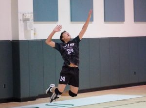 YiManuel Cortez (number 24) switches to airplane mode as he takes flight for the jump serve. He aces the powerful serve for another easy point. 