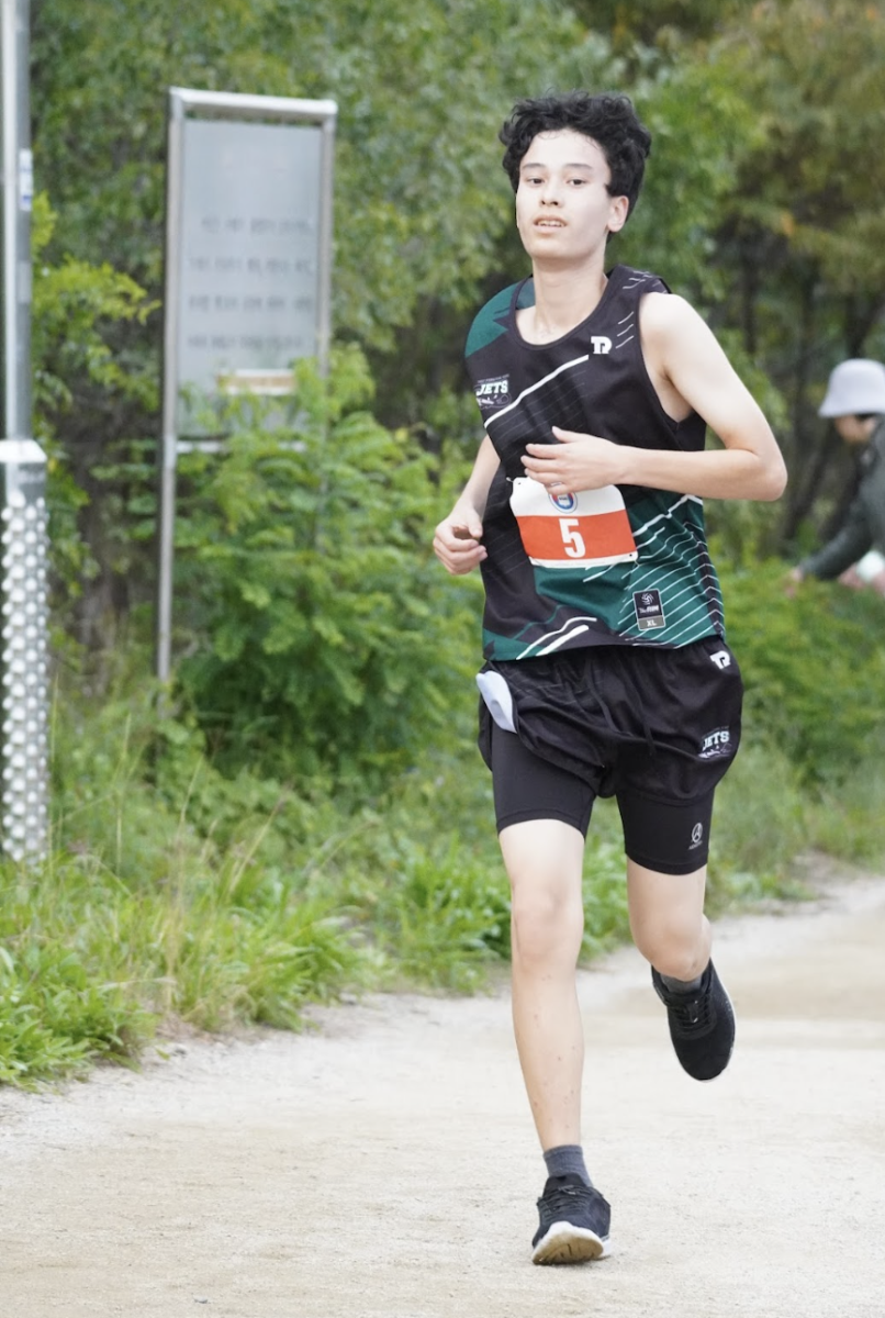 Freshman Joseph Chambless returns to the ISB course in cross country jersey. The lightweight design keeps him cool. 