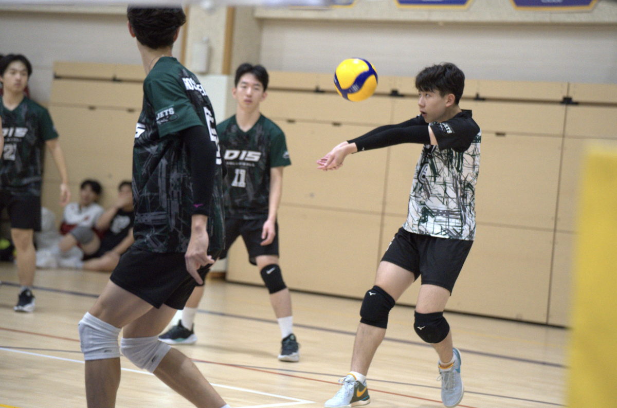 The boys' volleyball team dons their new uniforms for SKAIS. The dri-fit technology wicks their sweat away. 