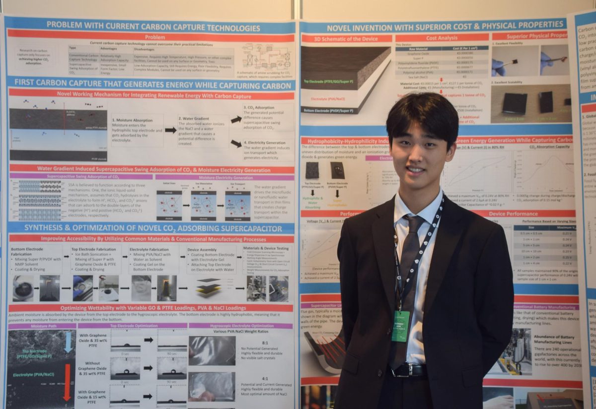 Senior Lewis Kim proudly presents his project at EUCYS. His invention is the first carbon-absorption device that could simultaneously generate electricity. Photo courtesy of Lewis Kim.