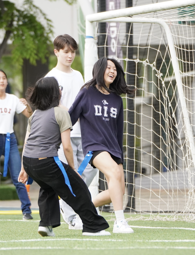 Yul Sakong in ninth grade sports the classic DIS crewneck sweatshirt at last year's middle school party. The sweatshirt is now for sale on THERIM. Photo by Flora Chung.