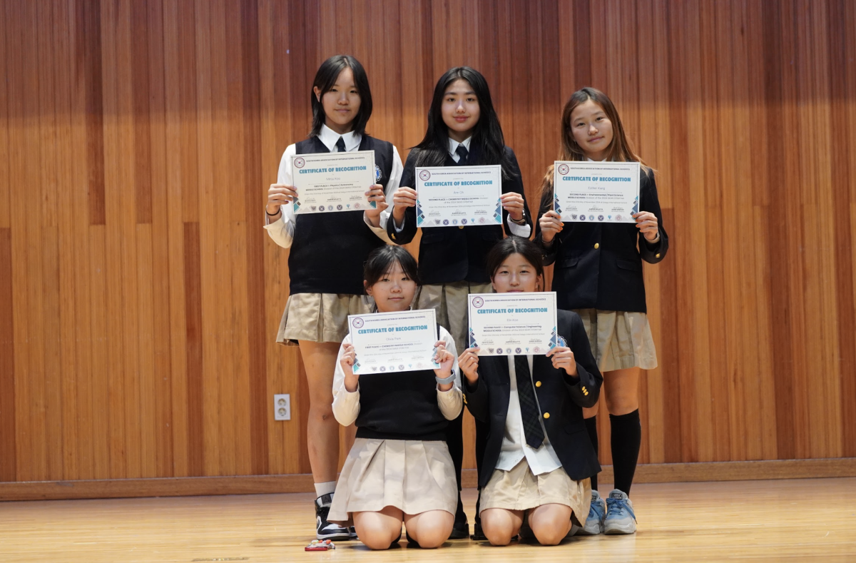 A crew of seventh-graders celebrate their success at the STEM fair, showcasing their innovative projects and demonstrating their teamwork and creativity.