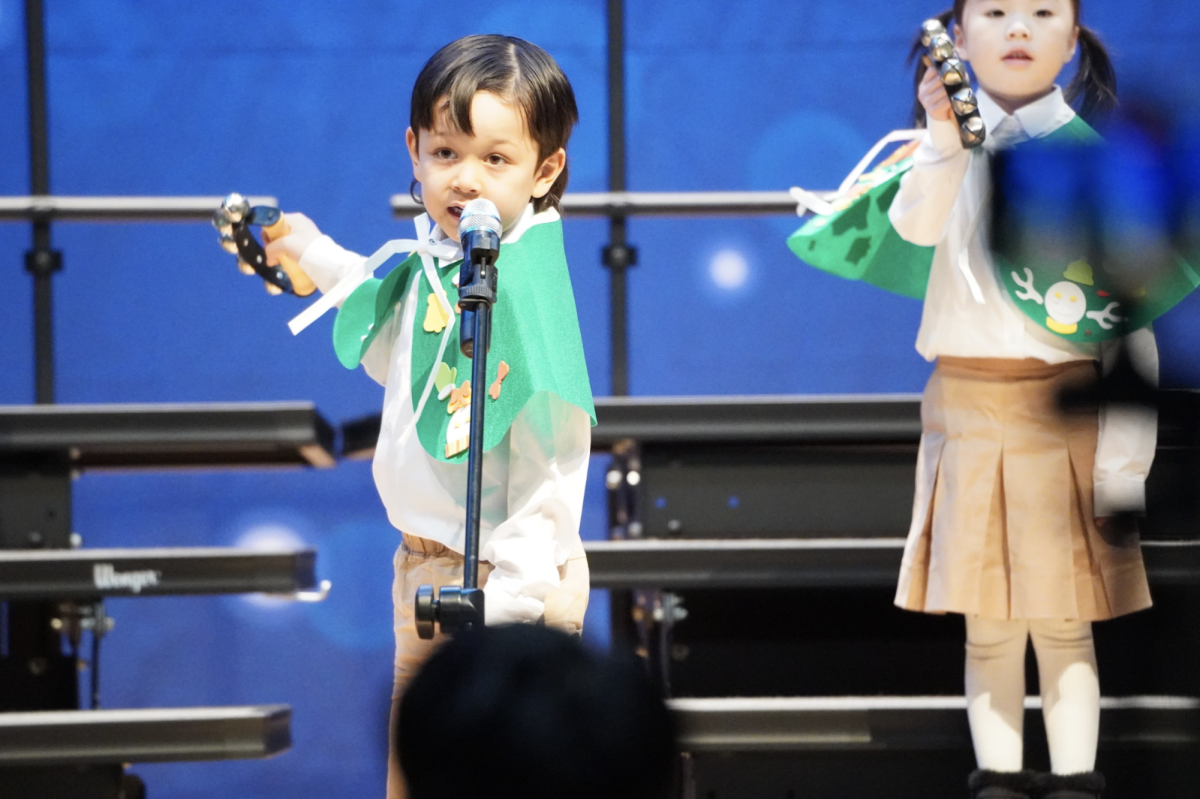 Kindergartener Amin Garbout takes the stage with confidence. The crowd admires his tree-mendous performance in awe. 