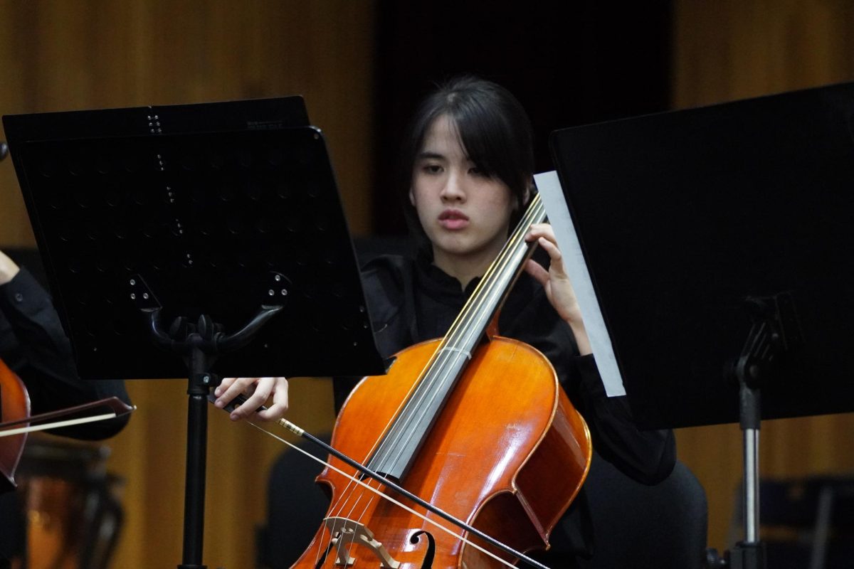 Senior Kate Lee carefully draws her bow across her cello. She immerses herself into the catchy tune of St. Paul's Suite. 