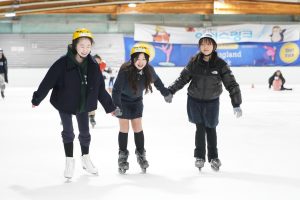 Seventh graders Arin Kwon, Isabel Bae, and Olivia Cho hold hands and attempt to stay balanced on the ice together. Aside from a few wobbles, their teamwork triumphs, as they gradually get the hang of skating. 