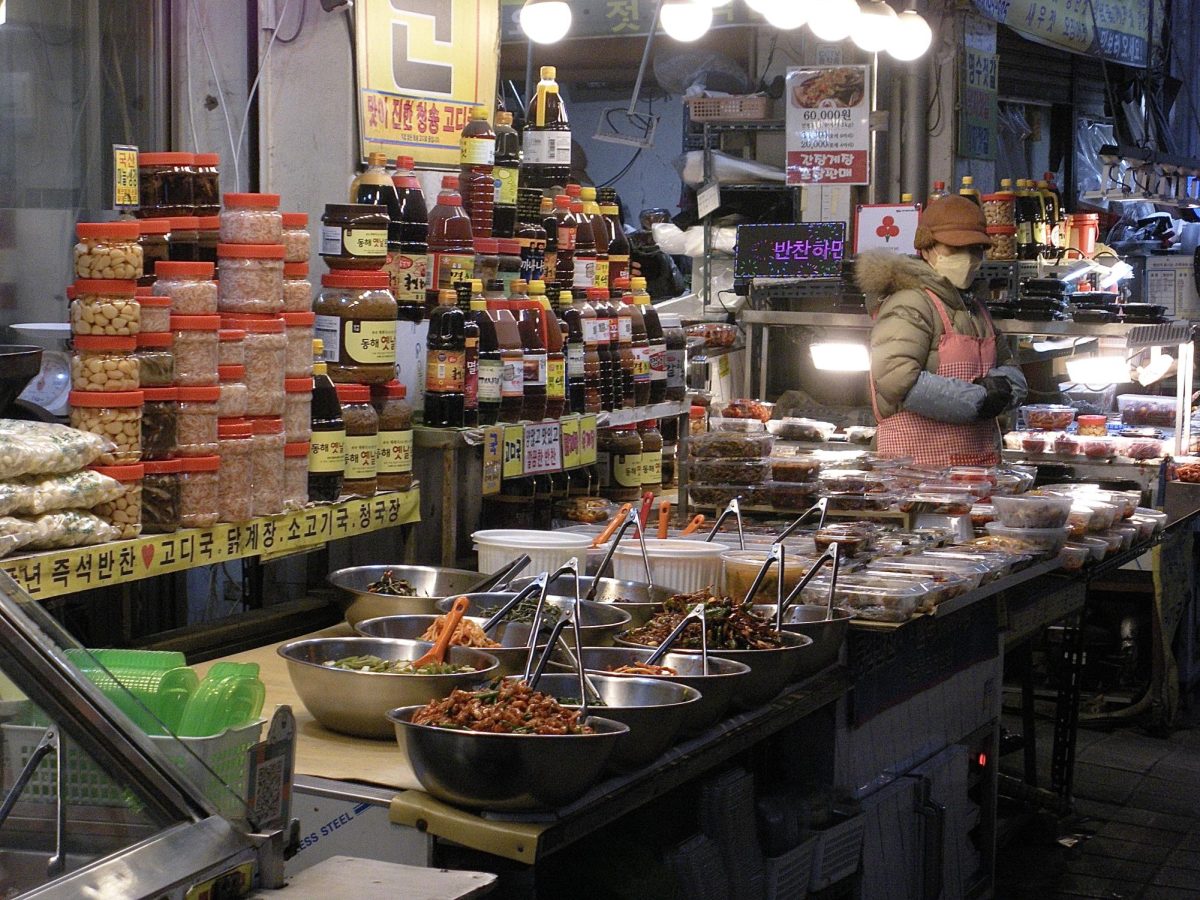 Colorful packages of banchan and soy sauce fill the countertops. Passersby can pick and choose what they want like at a deli bar, or purchase prepackaged options. 