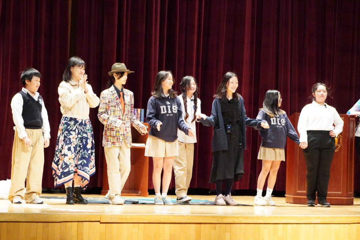 The Drama Club members take a well-earned bow, beaming with pride after their triumphant performance of Matilda. Their smiles shine with gratitude and confidence, reflecting the hard work and passion that brought the production to life. 