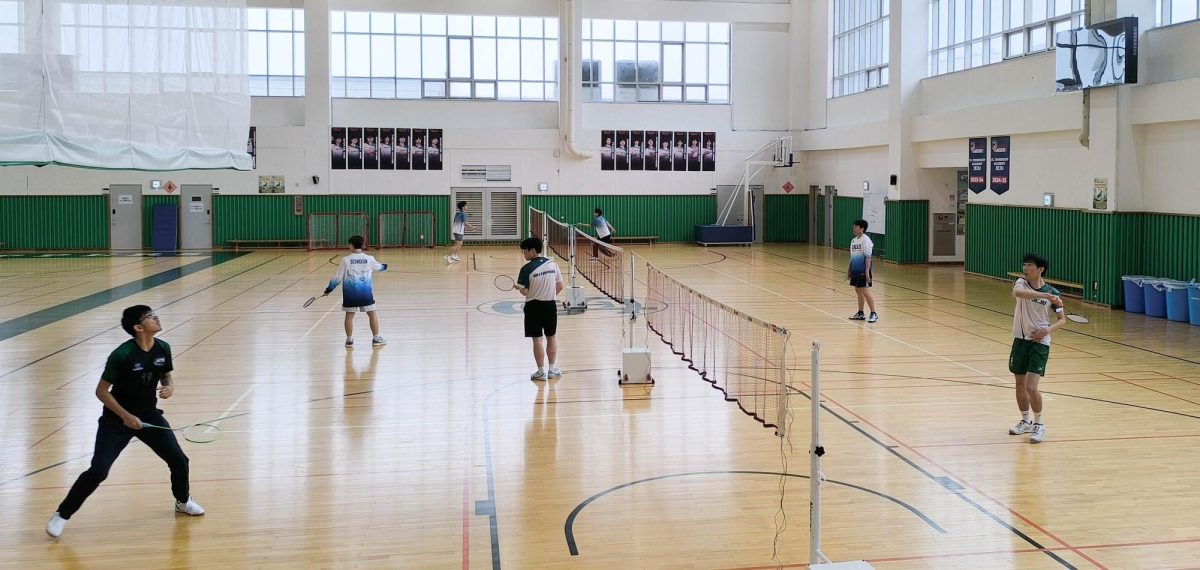 Freshman Chirayu Joshi focuses on the shuttlecock and prepares to smash it down the opponent's court. He improves his skills throughout the tournament and learn valuable lessons.