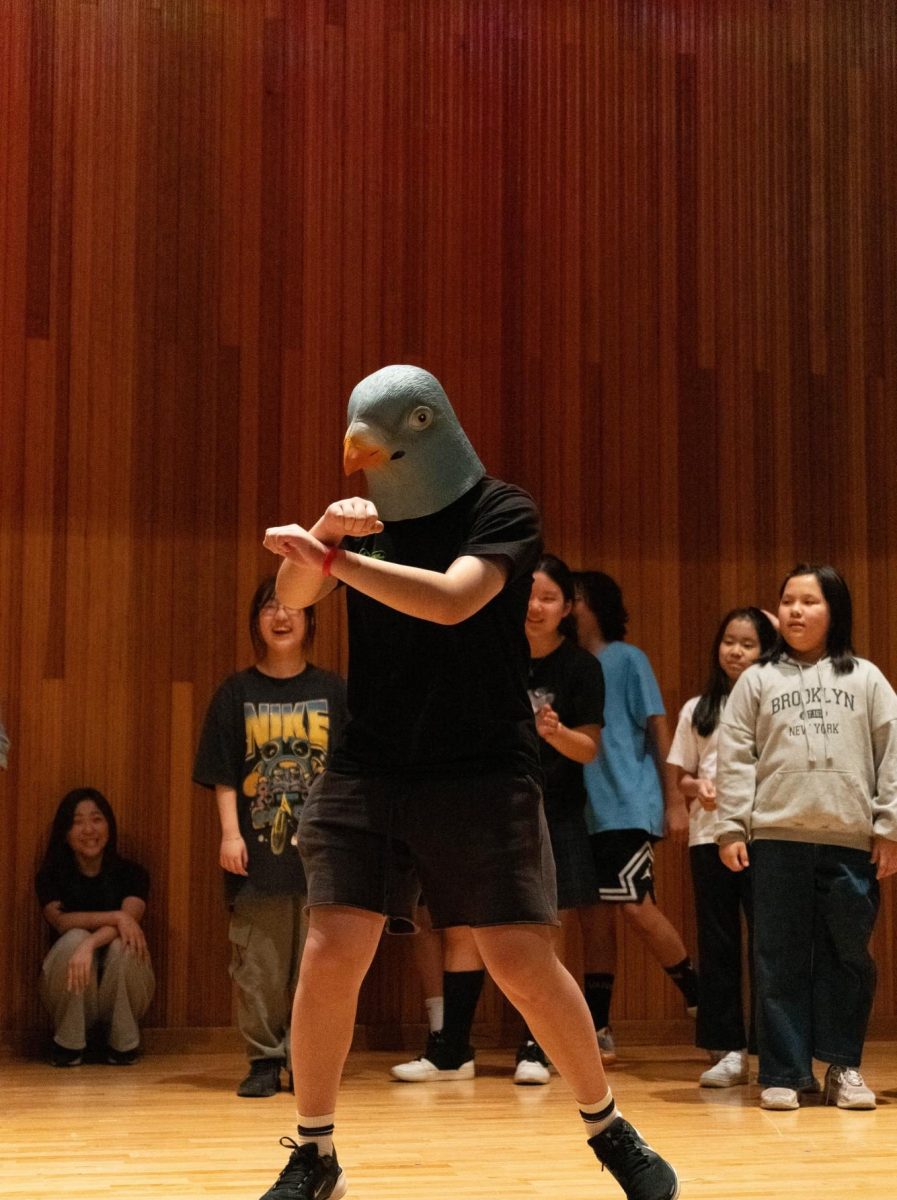 Eighth grader Ellie Park, A.K.A. Pigeon struts her stuff to “Gangnam Style.” Her horse dance draws hoots from the crowd.