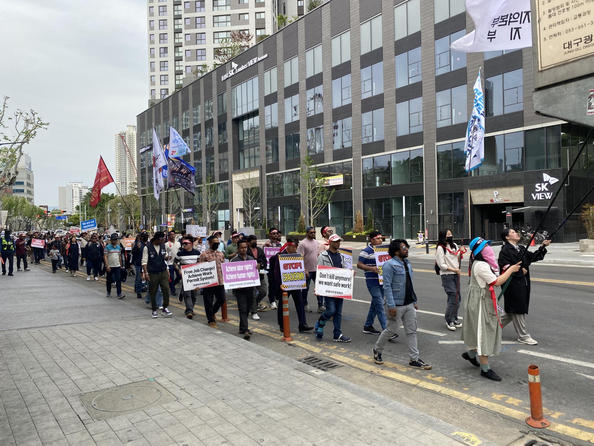 Members of the Korean Confederation of Trade Unions march through downtown Daegu, chanting for their rights. However, many of their demands lack feasibility.