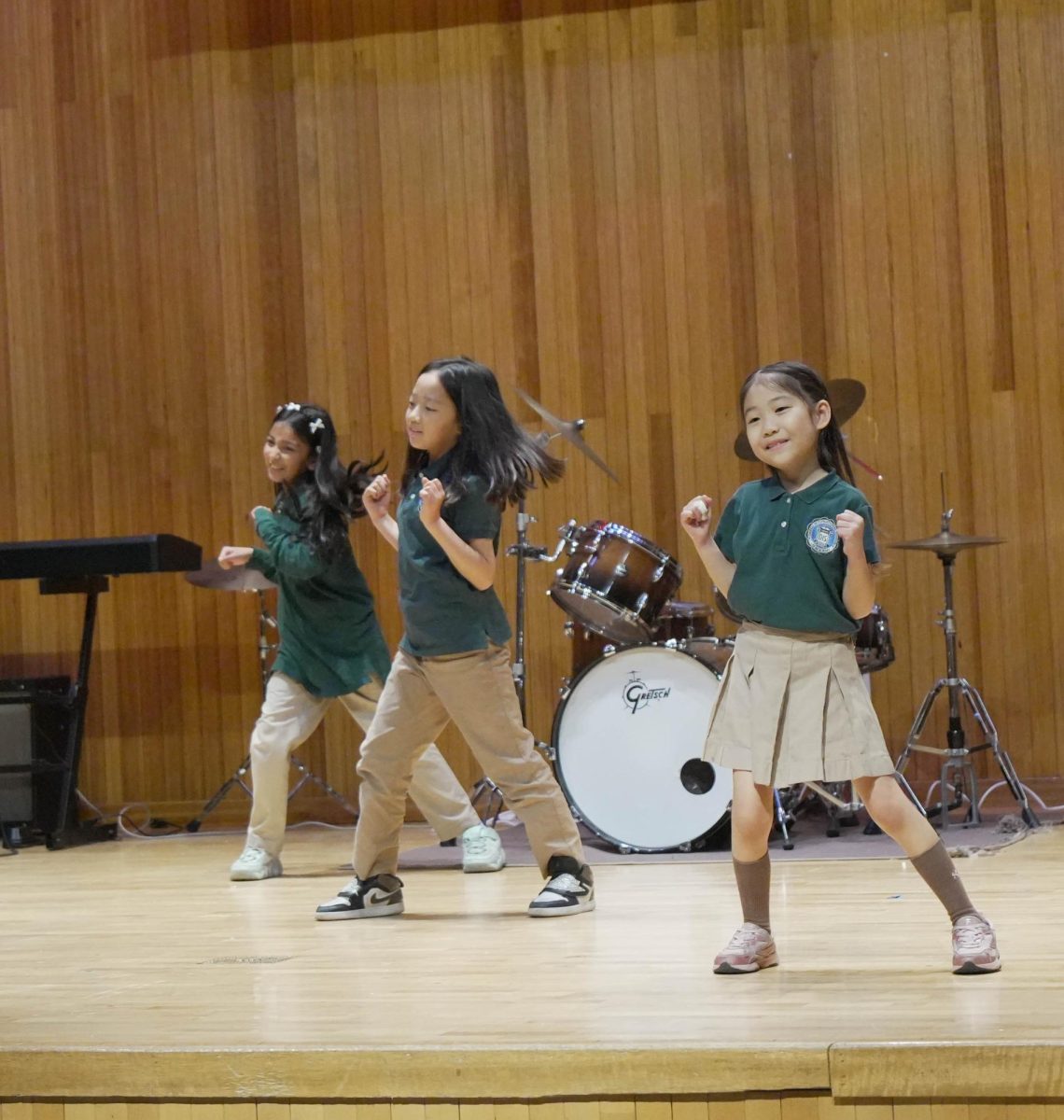 The Elementary Dance Team vibes to the groove of the music. With smiles on their faces, they enjoy the performance and spread the energy to the audience as well.
