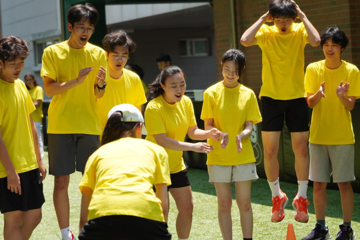 A group of eighth graders celebrate their success in matching the correct numbers. Their teamwork helps them finish the activity quickly, earning a well-deserved second-place finish. 