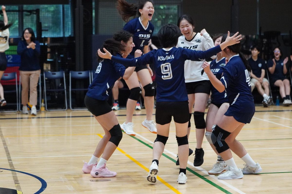 
The varsity girls erupt in celebration after a hard-fought rally, their teamwork and resilience shining in every play. United by determination, the squad’s spirit fuels their comeback momentum on the court. 