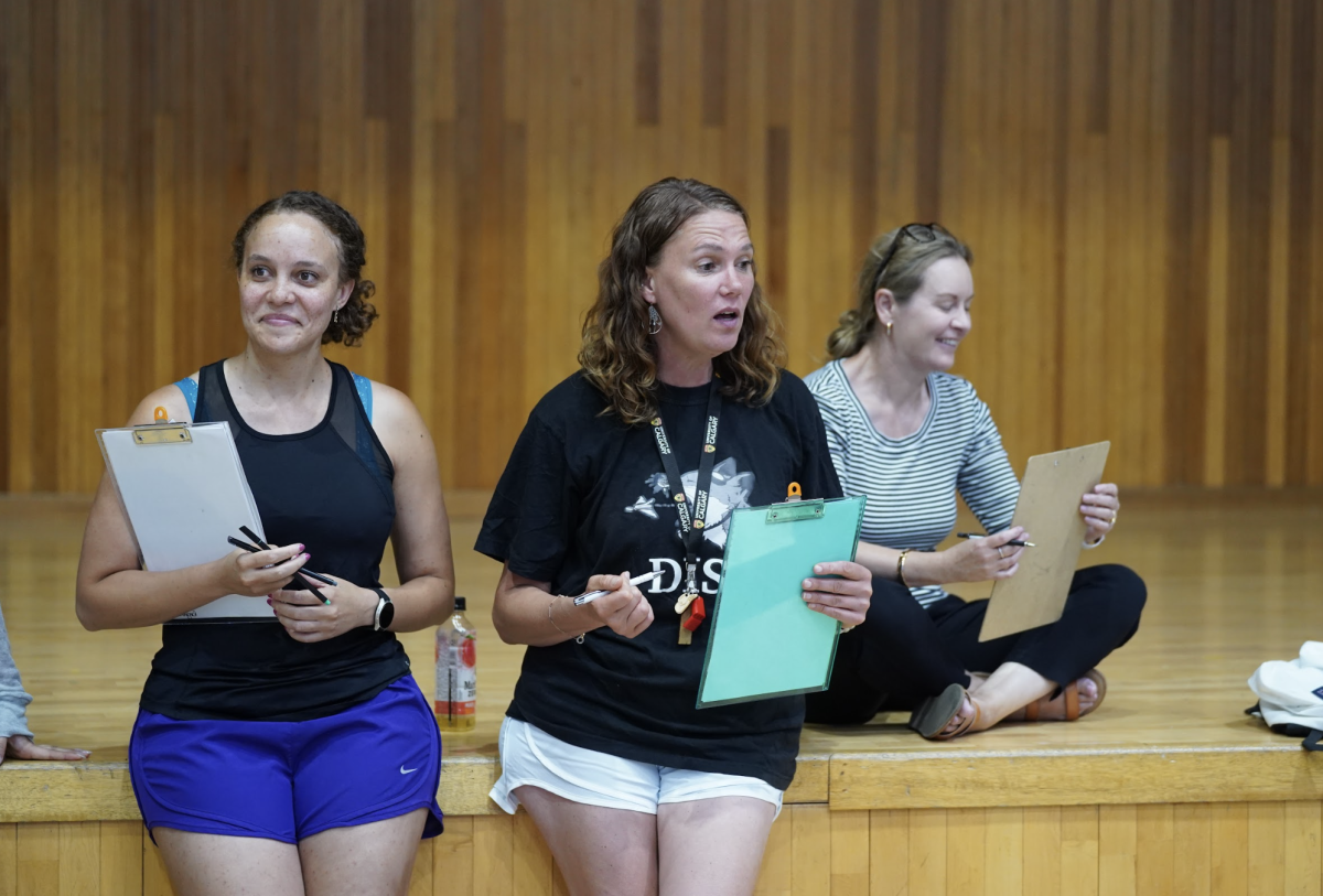 Ms. Dennard (left) focuses on the new girls vying for a spot and reflects on their moves. Mrs. Jolly (center) gives insightful advice to newcomers in hopes of improvements at the net.