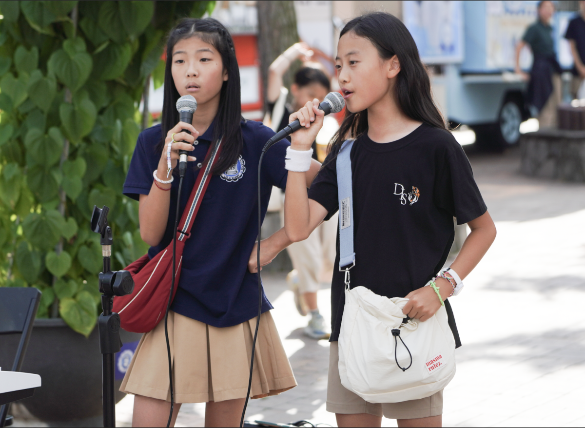 Fifth graders Adela Lee and Belle Kim captivate the audience with their harmonious voices, delivering each note with precision and grace. Their dynamic performance set an uplifting tone for the festivities.