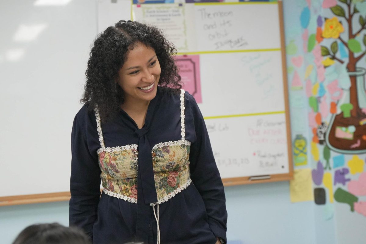 Mrs. Marchan beams at her sixth-grade Earth science class. Her excitement fuels her students’ passion for the subject.