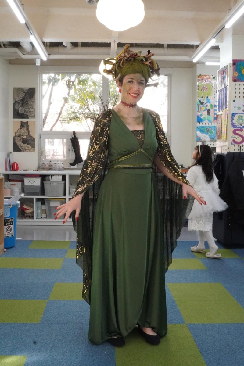 Primary art teacher Mrs. Gum turns her students into stone with her petrifying stare. As the youngsters turn gray, she lets out a wicked laugh. 