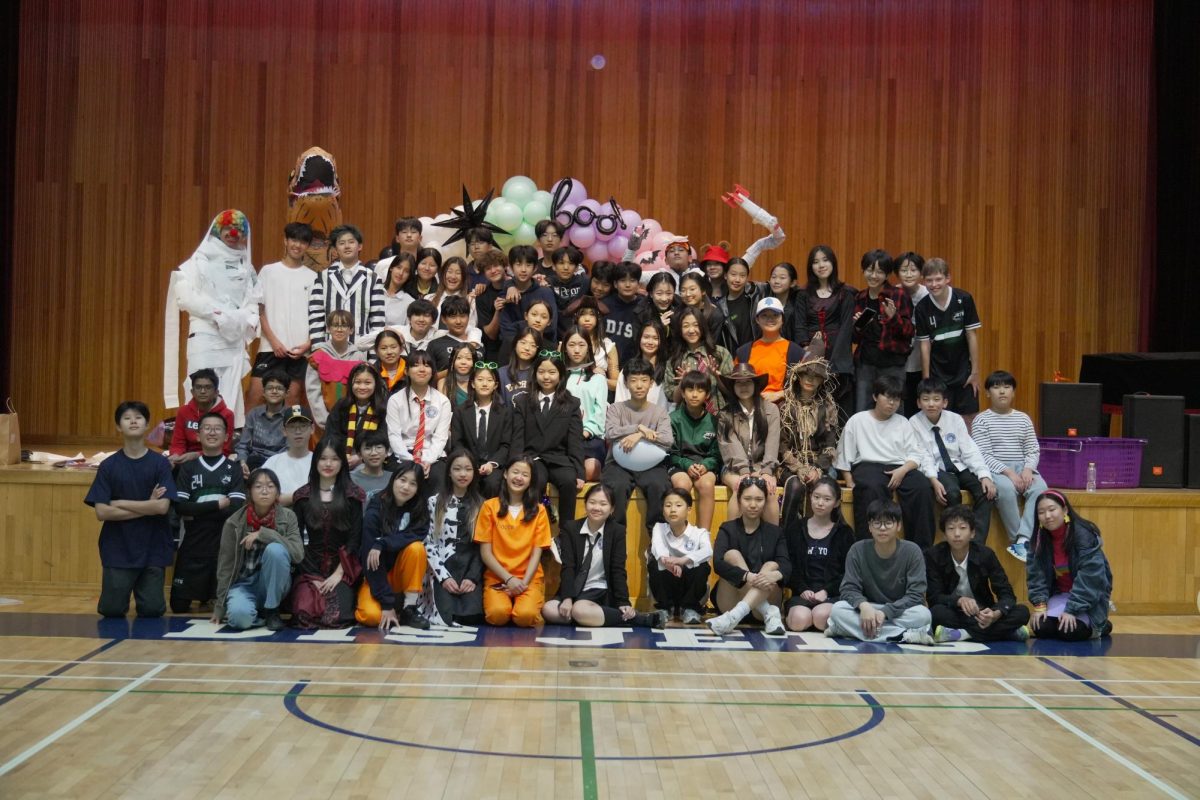 Secondary school students assemble for a group photo. Their proud faces and animated costumes capture the spirit of another successful MSSC event. 